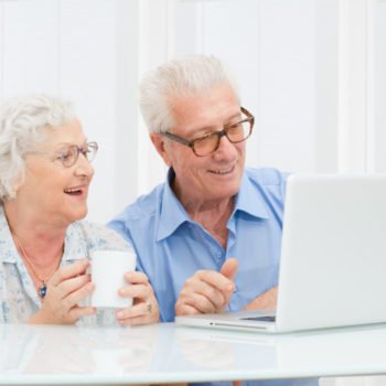 Senior couple with computer
